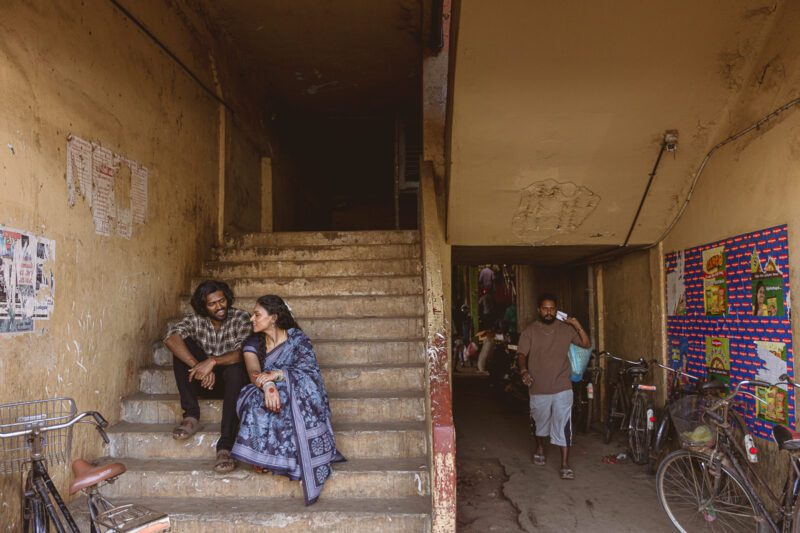 Candid shots of Kobe and Ramya exploring Tirunelveli Market, surrounded by local colors and culture. A playful moment from their Jaffna wedding story captured by Banu Photography.