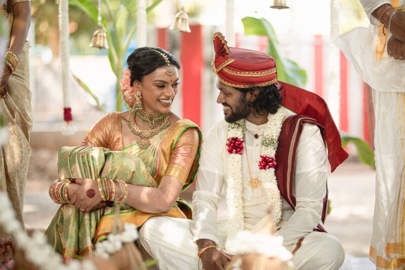 Kobe and Ramya exchanging vows at their native temple in Jaffna, surrounded by close family and friends. Traditional Tamil wedding captured by Banu Photography. Decor by Rohins Events, makeup by Vinthusha.