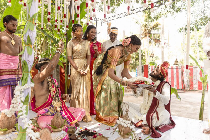 Kobe and Ramya exchanging vows at their native temple in Jaffna, surrounded by close family and friends. Traditional Tamil wedding captured by Banu Photography. Decor by Rohins Events, makeup by Vinthusha.