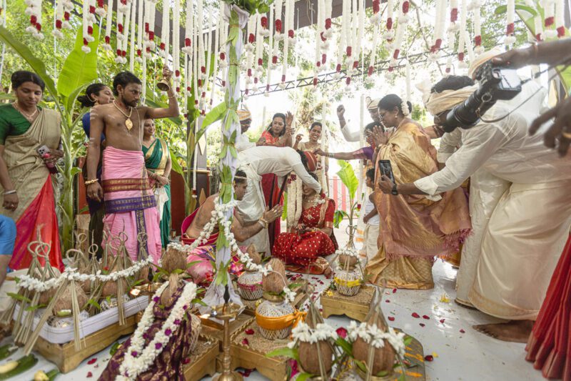 Kobe and Ramya exchanging vows at their native temple in Jaffna, surrounded by close family and friends. Traditional Tamil wedding captured by Banu Photography. Decor by Rohins Events, makeup by Vinthusha.