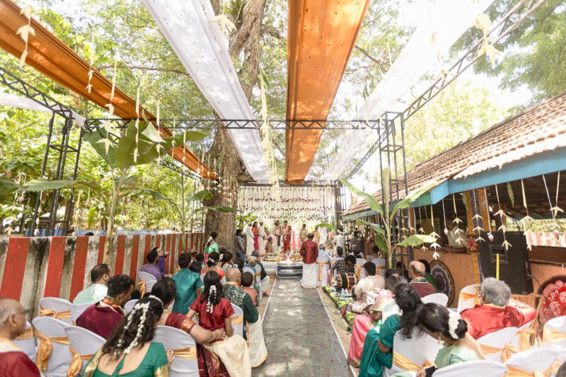 Kobe and Ramya exchanging vows at their native temple in Jaffna, surrounded by close family and friends. Traditional Tamil wedding captured by Banu Photography. Decor by Rohins Events, makeup by Vinthusha.