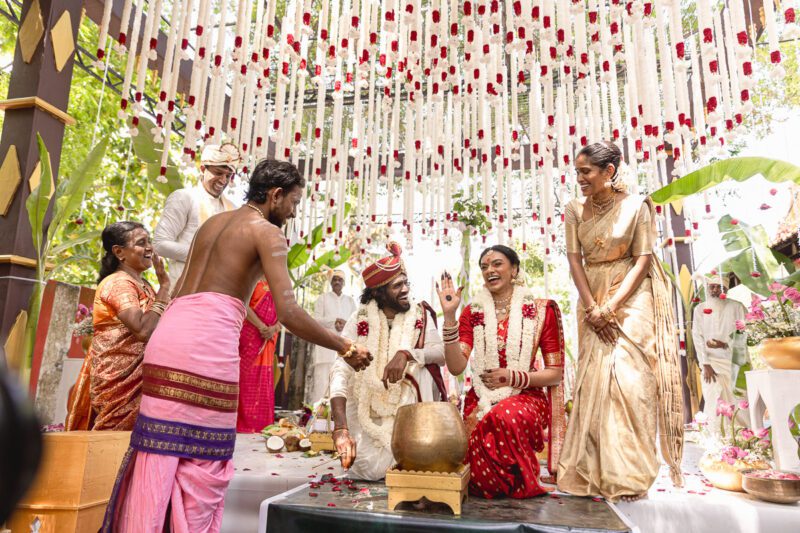 Kobe and Ramya exchanging vows at their native temple in Jaffna, surrounded by close family and friends. Traditional Tamil wedding captured by Banu Photography. Decor by Rohins Events, makeup by Vinthusha.