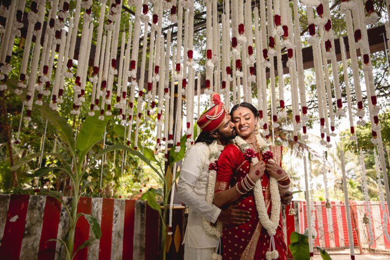 Kobe and Ramya exchanging vows at their native temple in Jaffna, surrounded by close family and friends. Traditional Tamil wedding captured by Banu Photography. Decor by Rohins Events, makeup by Vinthusha.