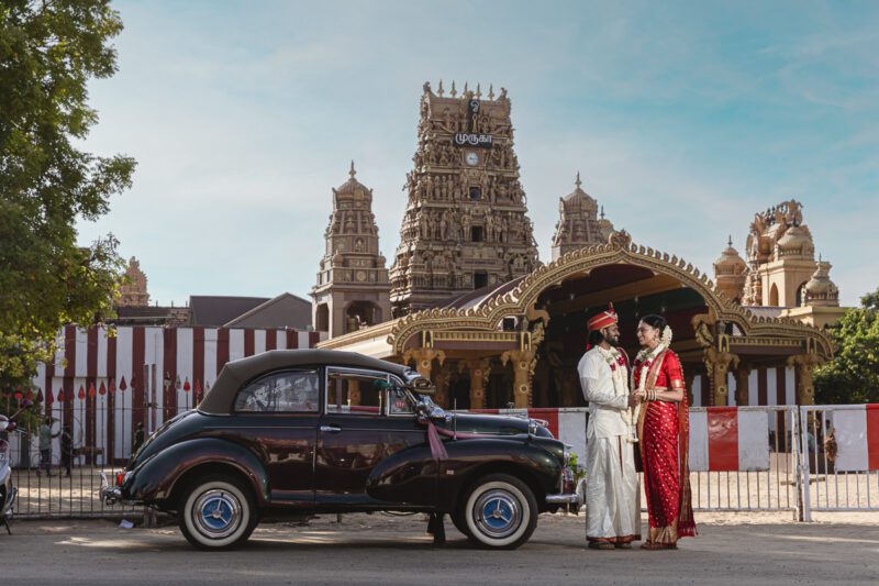 Kobe and Ramya in traditional attire at Nallur Kandasamy Kovil, one of Jaffna’s most sacred Hindu temples. Spiritual and vibrant portraits by Banu Photography.
