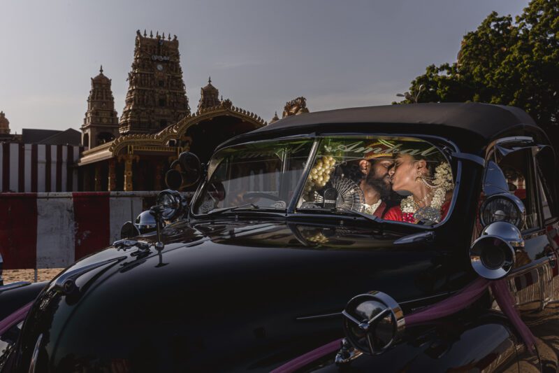 Kobe and Ramya in traditional attire at Nallur Kandasamy Kovil, one of Jaffna’s most sacred Hindu temples. Spiritual and vibrant portraits by Banu Photography.