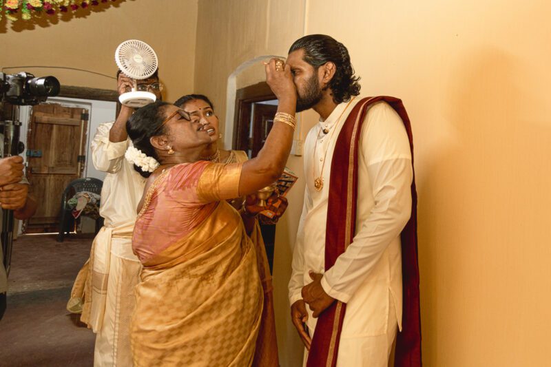 Kobe and Ramya exchanging vows at their native temple in Jaffna, surrounded by close family and friends. Traditional Tamil wedding captured by Banu Photography. Decor by Rohins Events, makeup by Vinthusha.